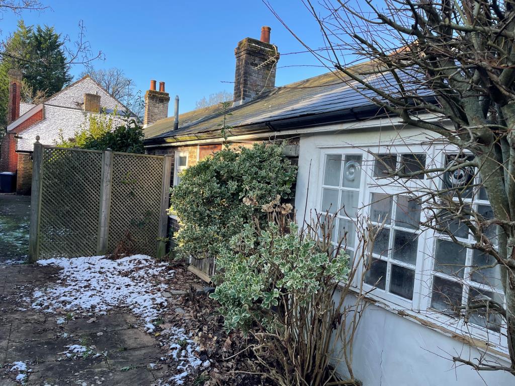 Lot: 134 - FORMER VILLAGE HALL WITH CONSENT FOR CONVERSION INTO SIX RESIDENTIAL DWELLINGS - Rear view from side access